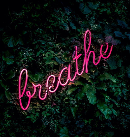 "breathe" neon sign