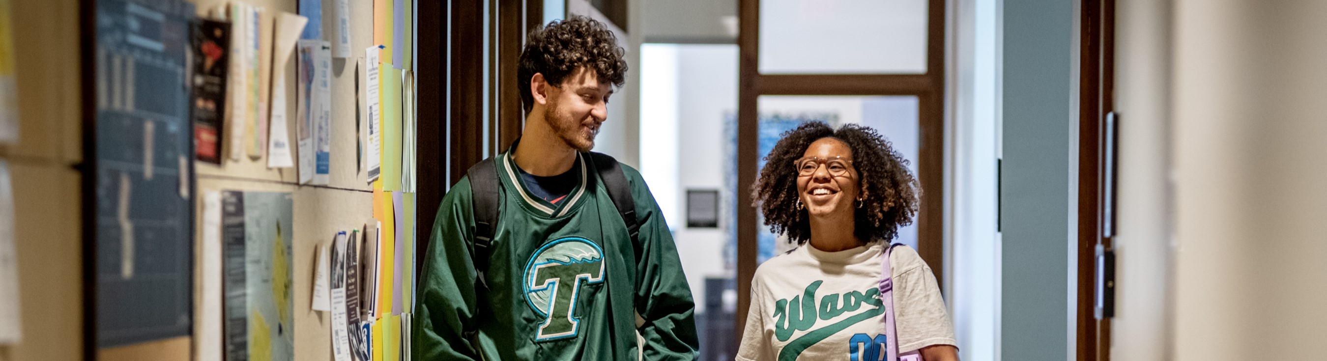 Two MSW students walk through Tulane School of Social Work.