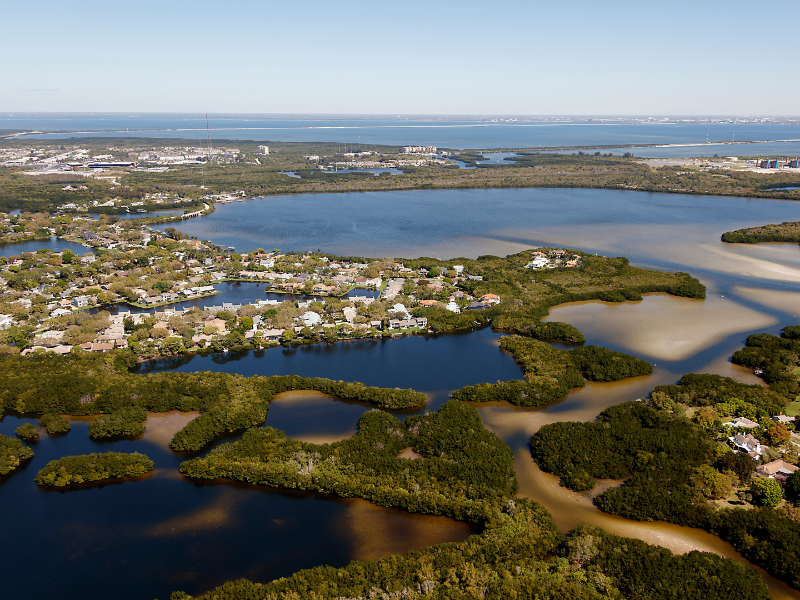 A community of homes and businesses sit within a delta region.