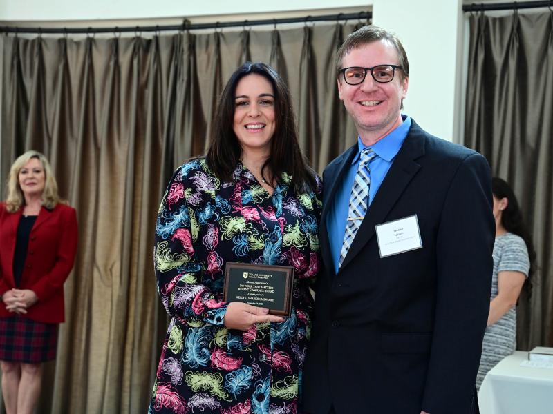 Kelly C. Sharkey accepts her alumni award