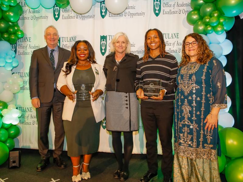 Two students hold glass Dr. King Student Leadership Awards. They stand beside Robin Foreman, Dean Susan Davies, and Dr. Anneliese Singh.