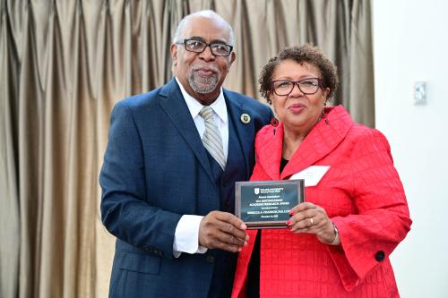 Rebecca Chaisson accepts her alumni award.