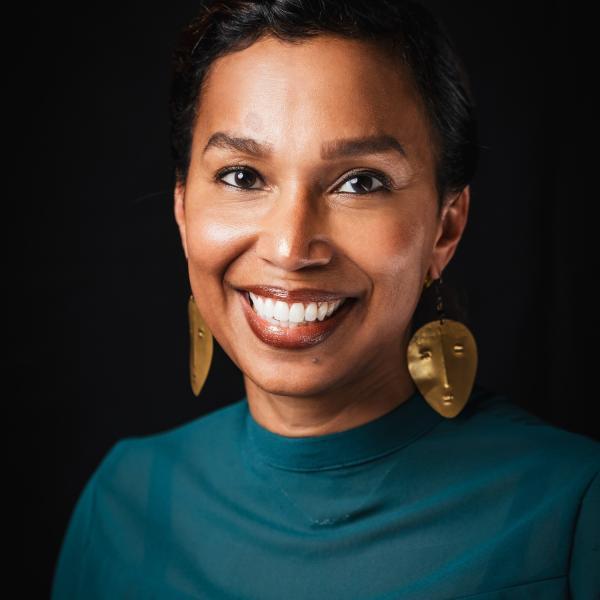 Head and shoulders studio portrait of Maurya Glaude.