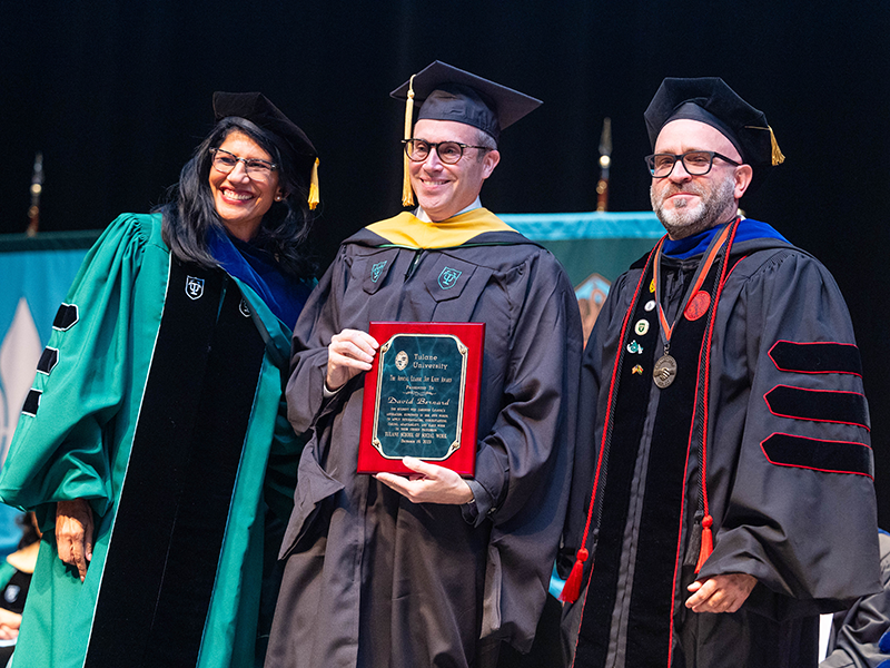 TSSW graduate David Bernard receives an award at commencement