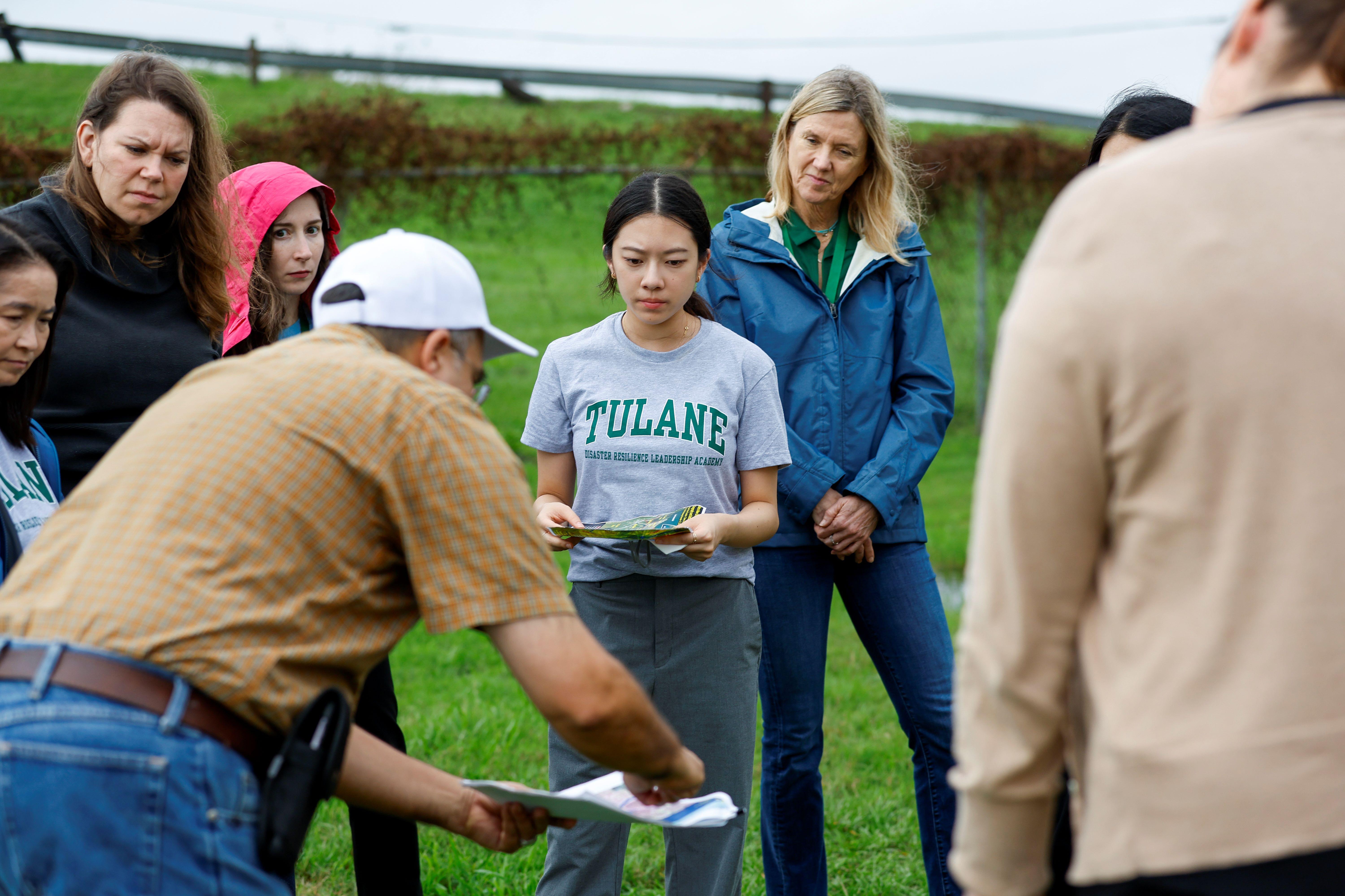 A professor teaches DRLA students about New Orleans's disaster resilience landscape.