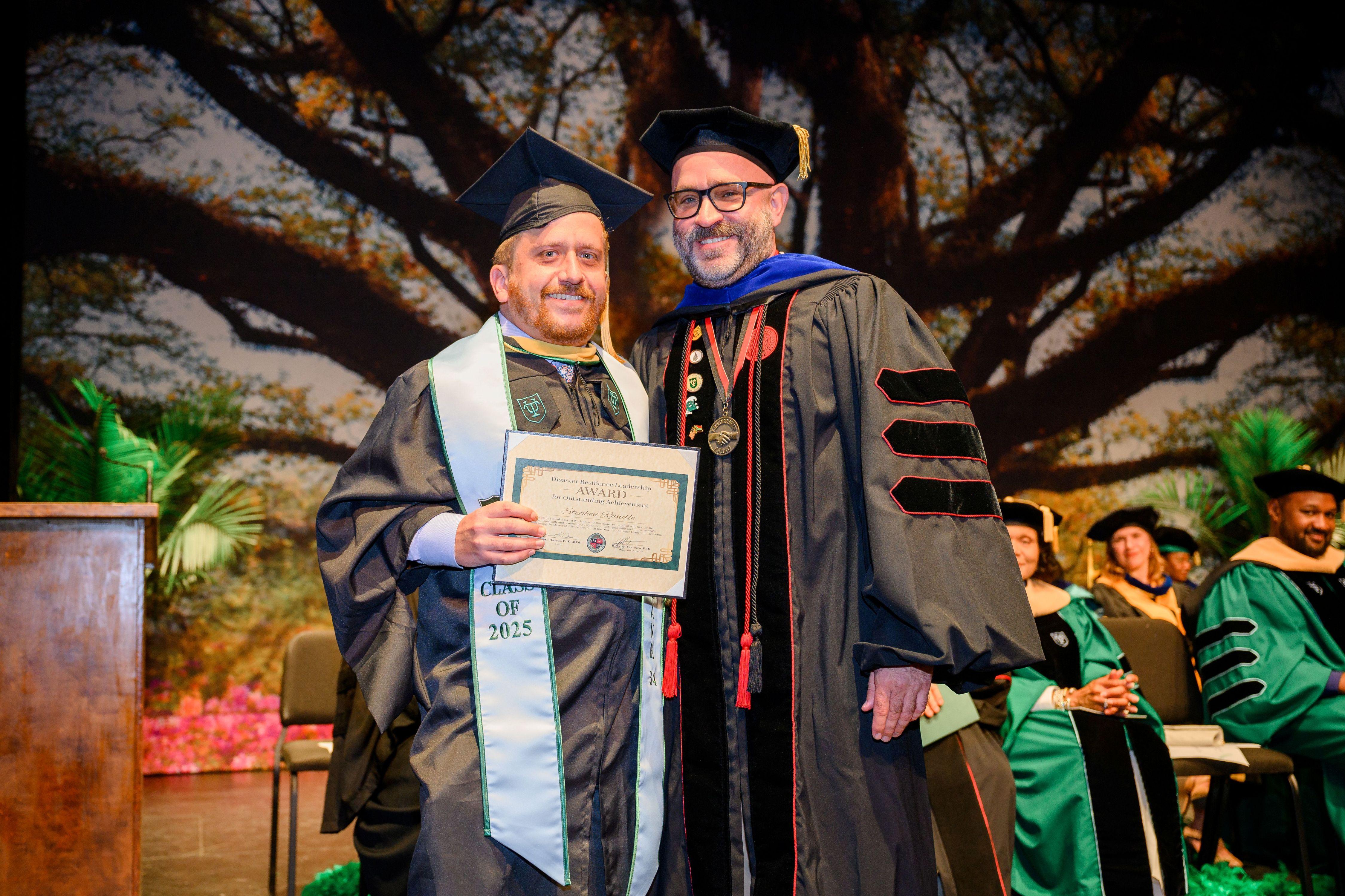 Stephen Randle stands beside Dr. Reggie Ferreira.