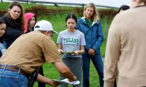 A professor teaches DRLA students about New Orleans's disaster resilience landscape.