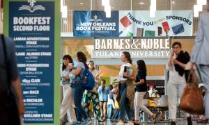 Students walk under the Book Festival 2024 banner.