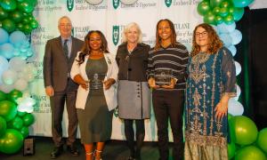 Two students hold glass Dr. King Student Leadership Awards. They stand beside Robin Foreman, Dean Susan Davies, and Dr. Anneliese Singh.